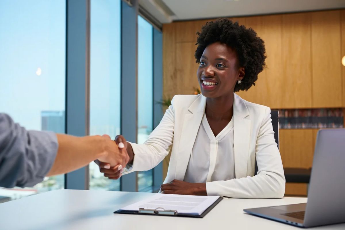 Two ladies talking over a contract